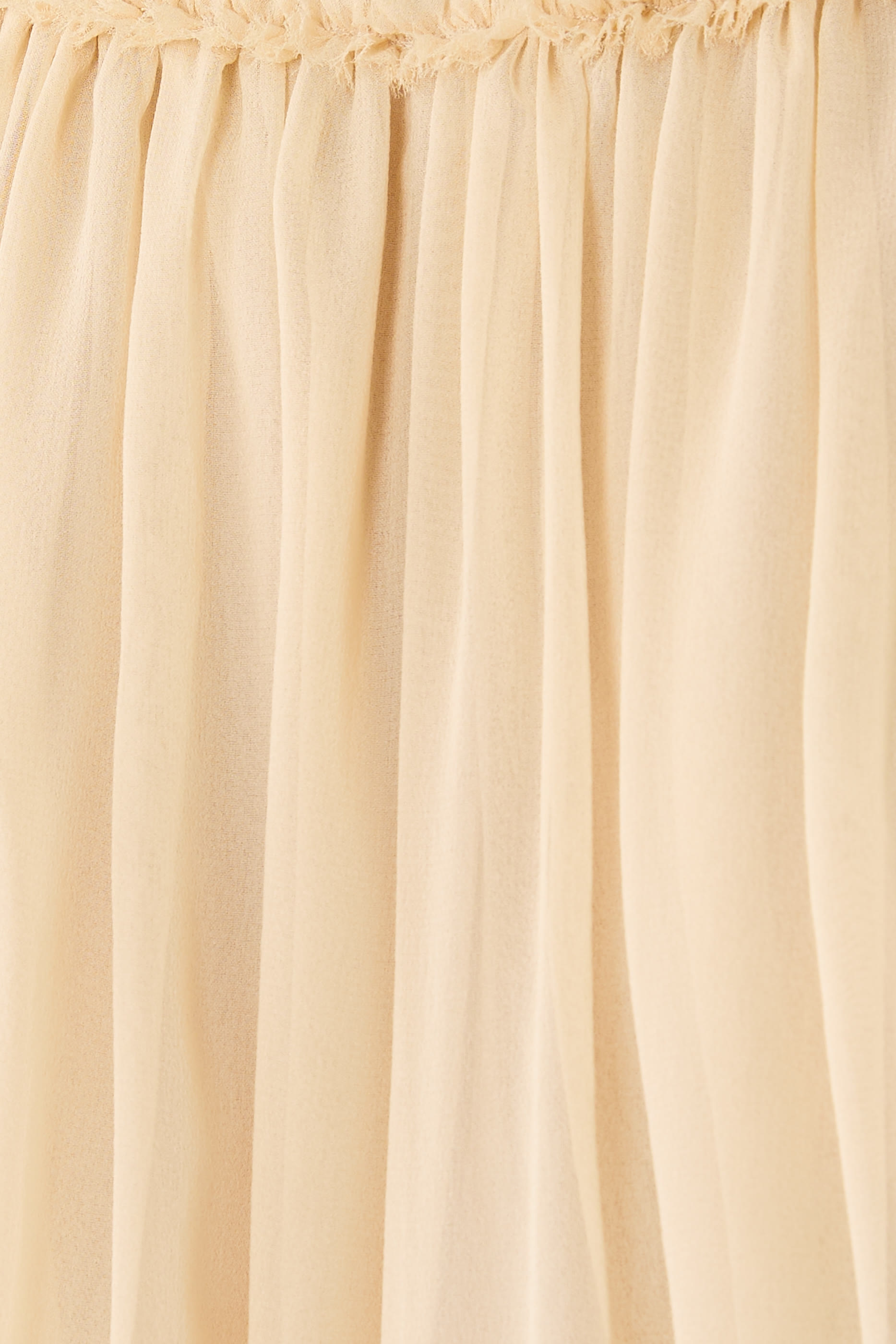 بلوزة ريبالين بقصة مريحة وحافة منسلة