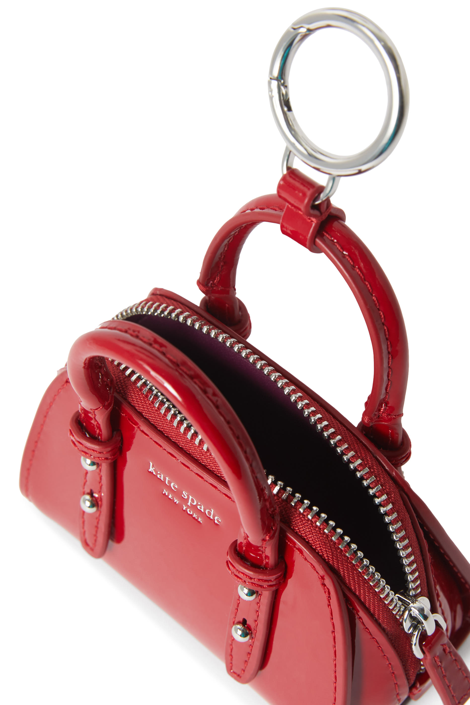 حلية نانو بتصميم حقيبة يد جلد لامع