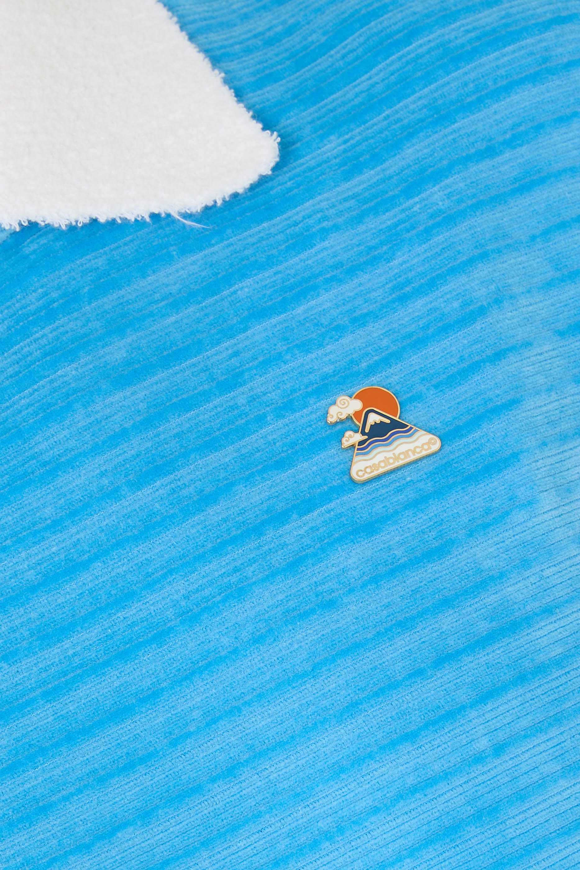 قميص بولو بأكمام قصيرة مخمل