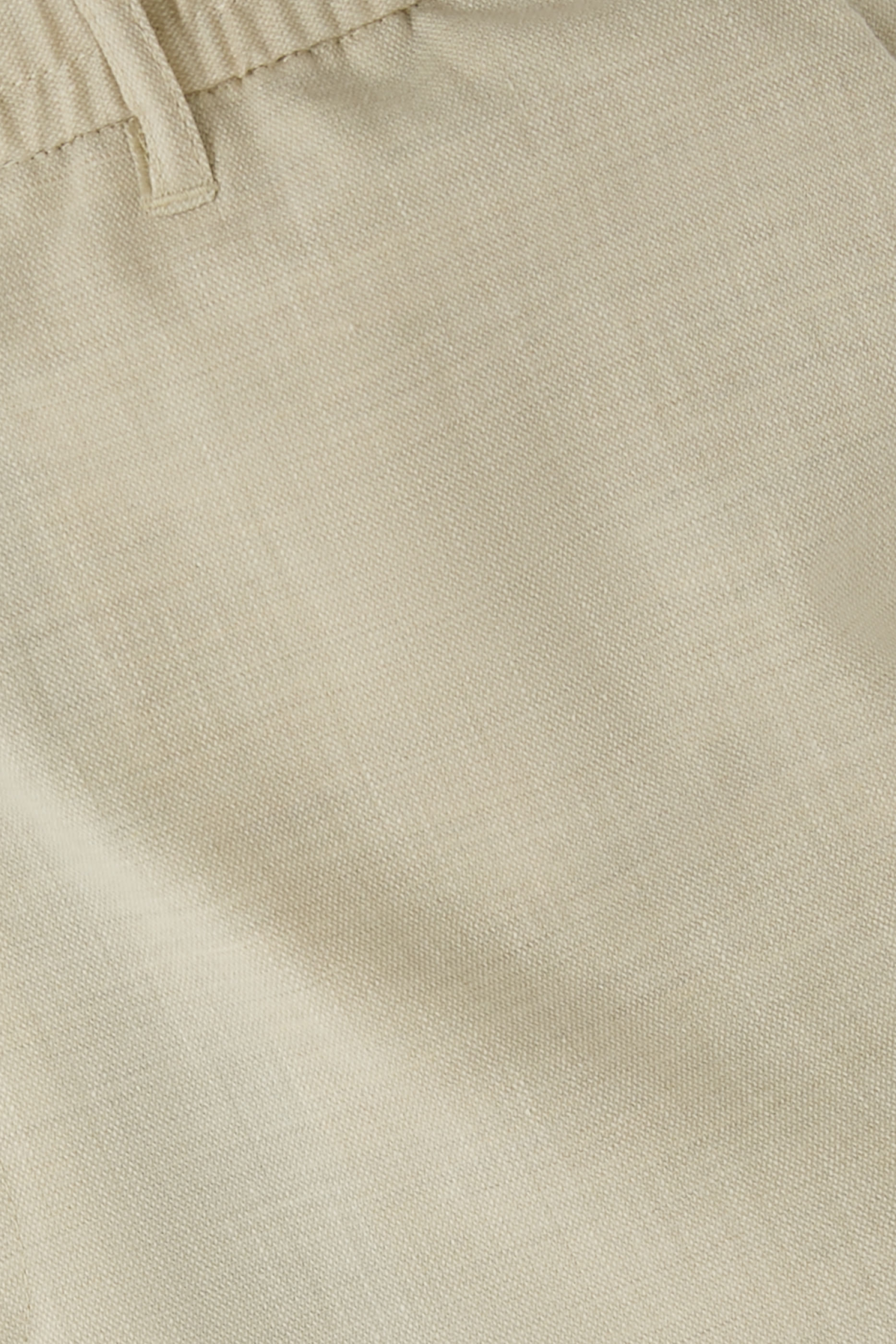 بنطال كومو بقصة ضيقة من الأسفل قماش بارز