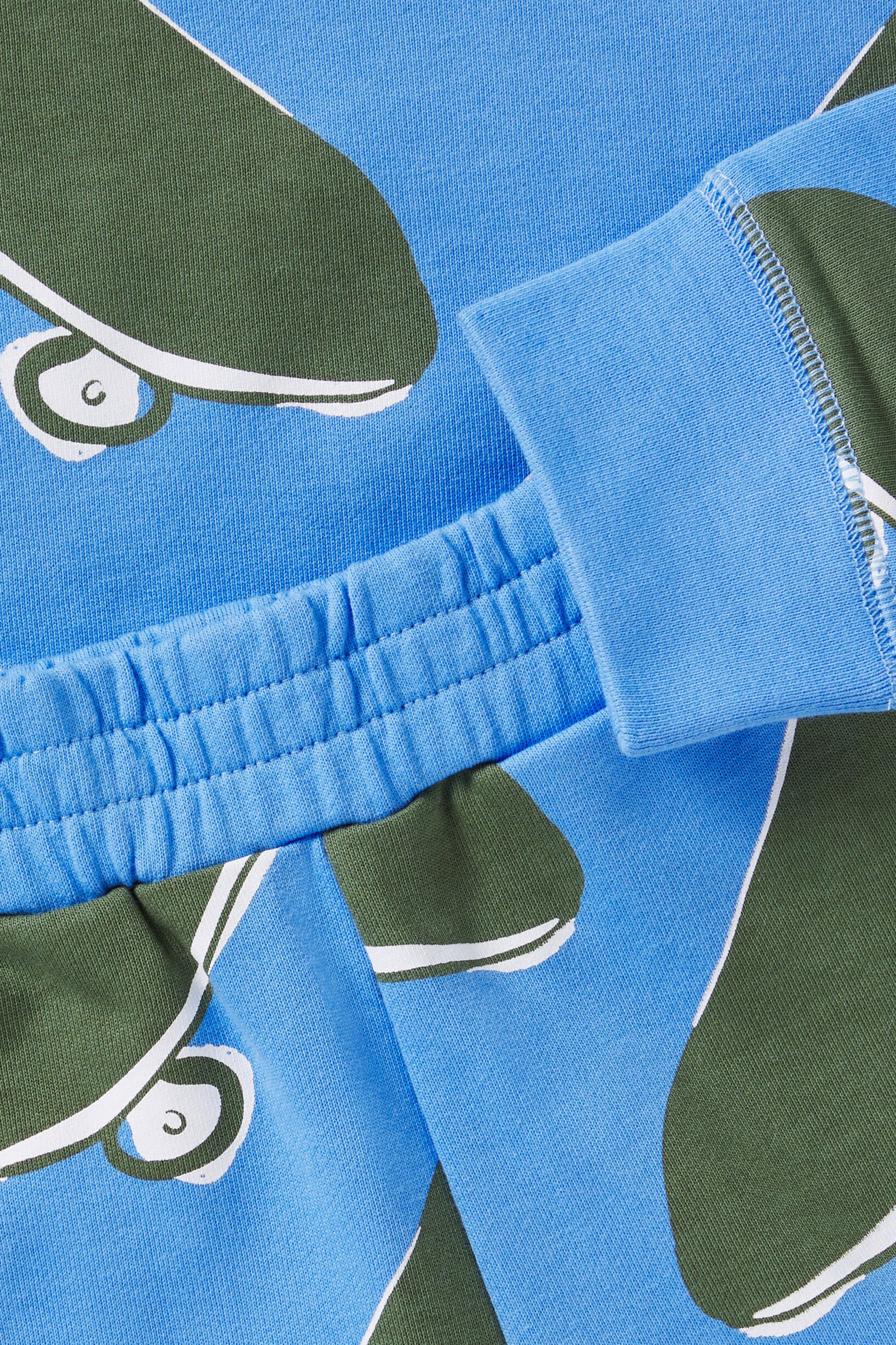 طقم سويت شيرت وشورت بنقشة لوح التزلج للأطفال