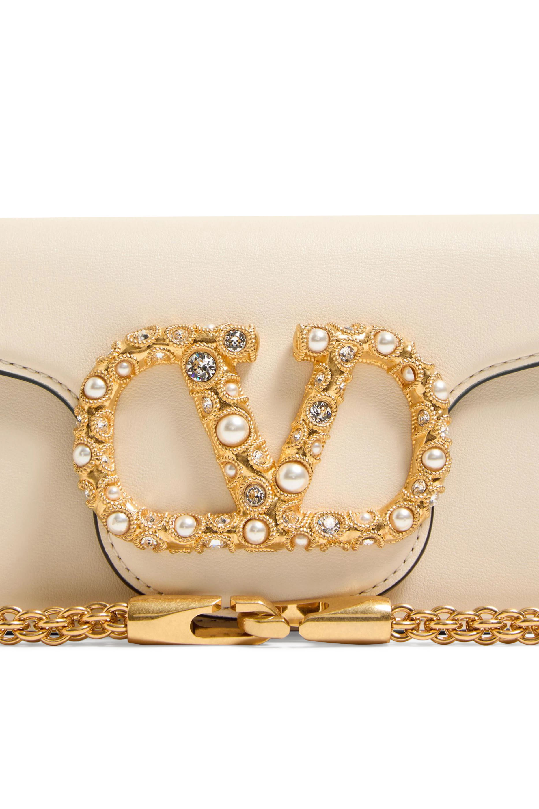 حقيبة كتف لوكو صغيرة بحلي شعار الماركة المرصعة بأحجار